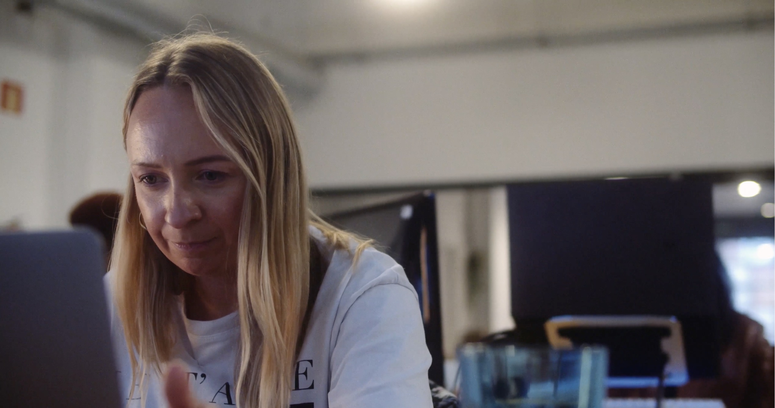 A CodeOp student concentrating at her laptop, Women in Tech by Joris Skudra